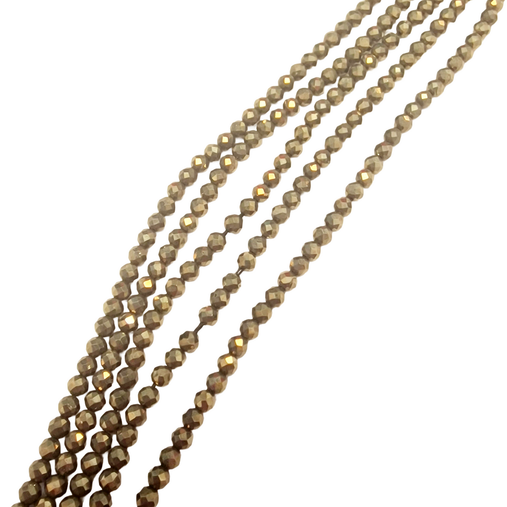 Close-up of Pyrite 4mm Faceted Beads showing detail