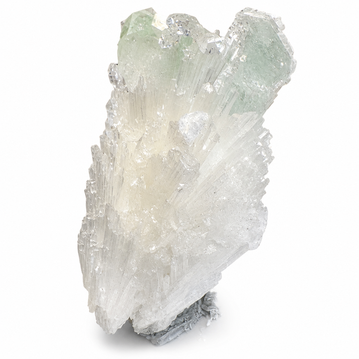 Close-up of translucent Green Apophyllite crystals with reflective glassy faces and fine white Scolecite needles from Jalgaon District, India.