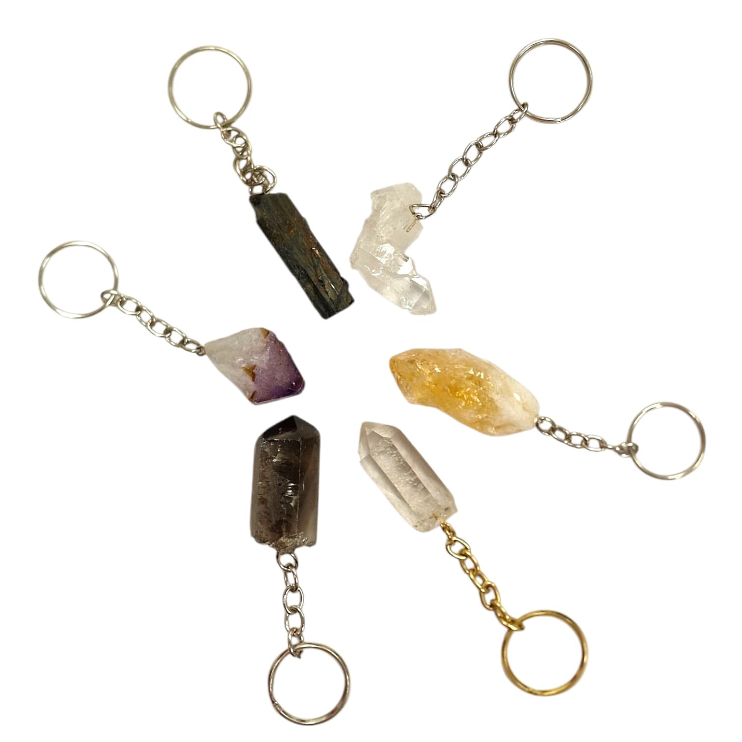 GeoFossils Crystal Keyring Collection featuring Black Tourmaline, Quartz Cluster, Smokey Quartz, and Citrine for grounding, protection, clarity, and positivity.