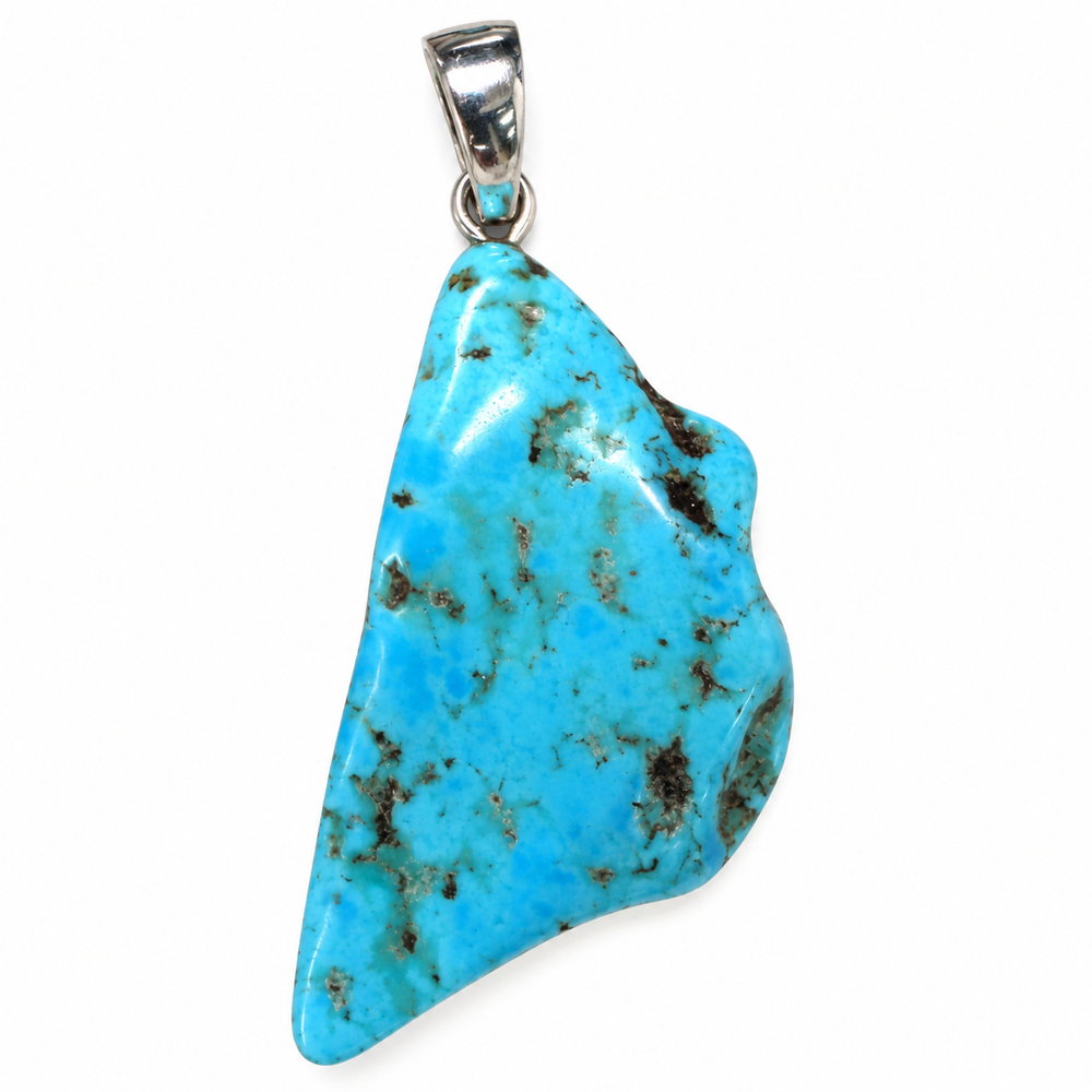 GeoFossils reverse view of the Kingman Mine Turquoise pendant, showing blue turquoise with scattered dark mineral matrix inclusions, an irregular polished shape and sterling silver fitting.