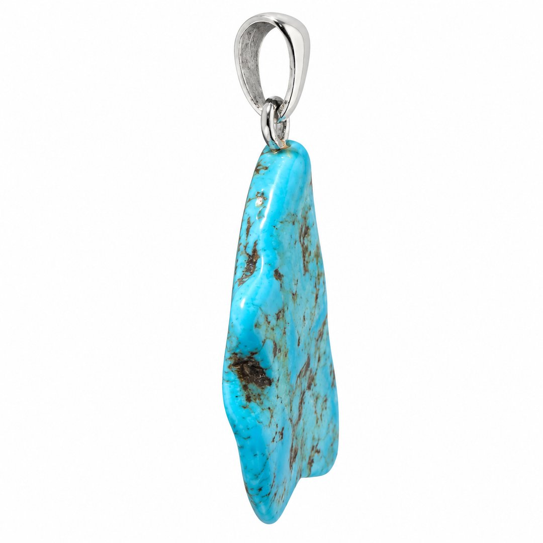 GeoFossils side profile of the Kingman Mine Turquoise pendant, highlighting the gemstone's curved thickness, polished edges, blue colouration and sterling silver bail.