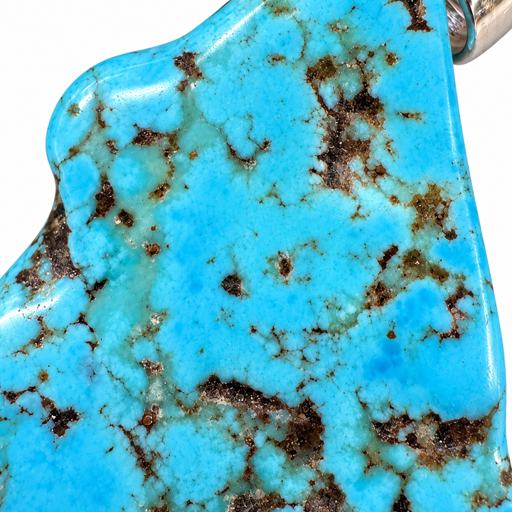 GeoFossils extreme macro close-up of Kingman Mine Turquoise, showcasing intricate dark brown matrix veining, blue and pale green mineral patterns and the polished gemstone surface.