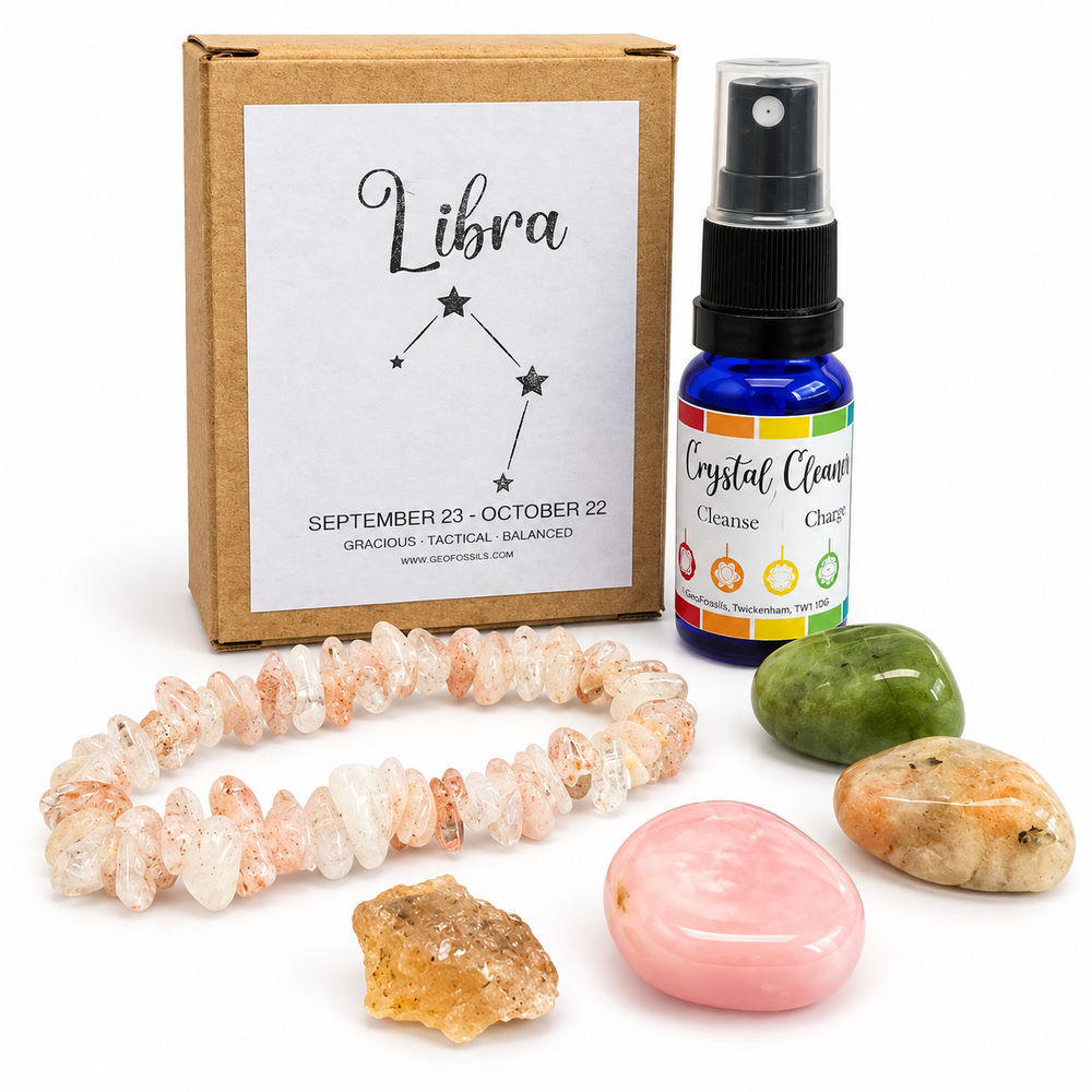 GeoFossils Libra zodiac crystal gift set with branded box, crystal cleansing spray, chip bracelet, polished stones and raw crystal on a white background.