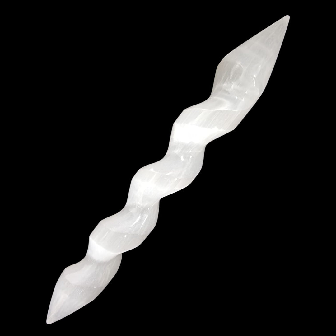 Double terminated Selenite massage wand featuring a carved spiral design, perfect for energy flow, cleansing rituals, and spiritual alignment.