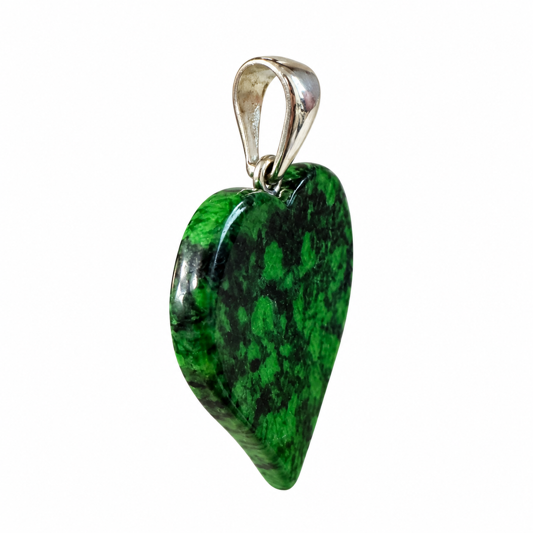 GeoFossils side profile of the Maw Sit Sit heart pendant from Burma (Myanmar), showing the polished gemstone's thickness, curved edges and sterling silver bail.