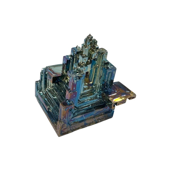 Medium Bismuth mineral specimen in hand to show size, displaying blue, green, and pink hues.