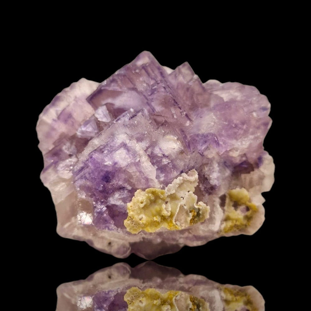 GeoFossils Fluorite with Smithsonite Mineral Specimen – UV reactive crystal showing translucent fluorite with delicate smithsonite formations.