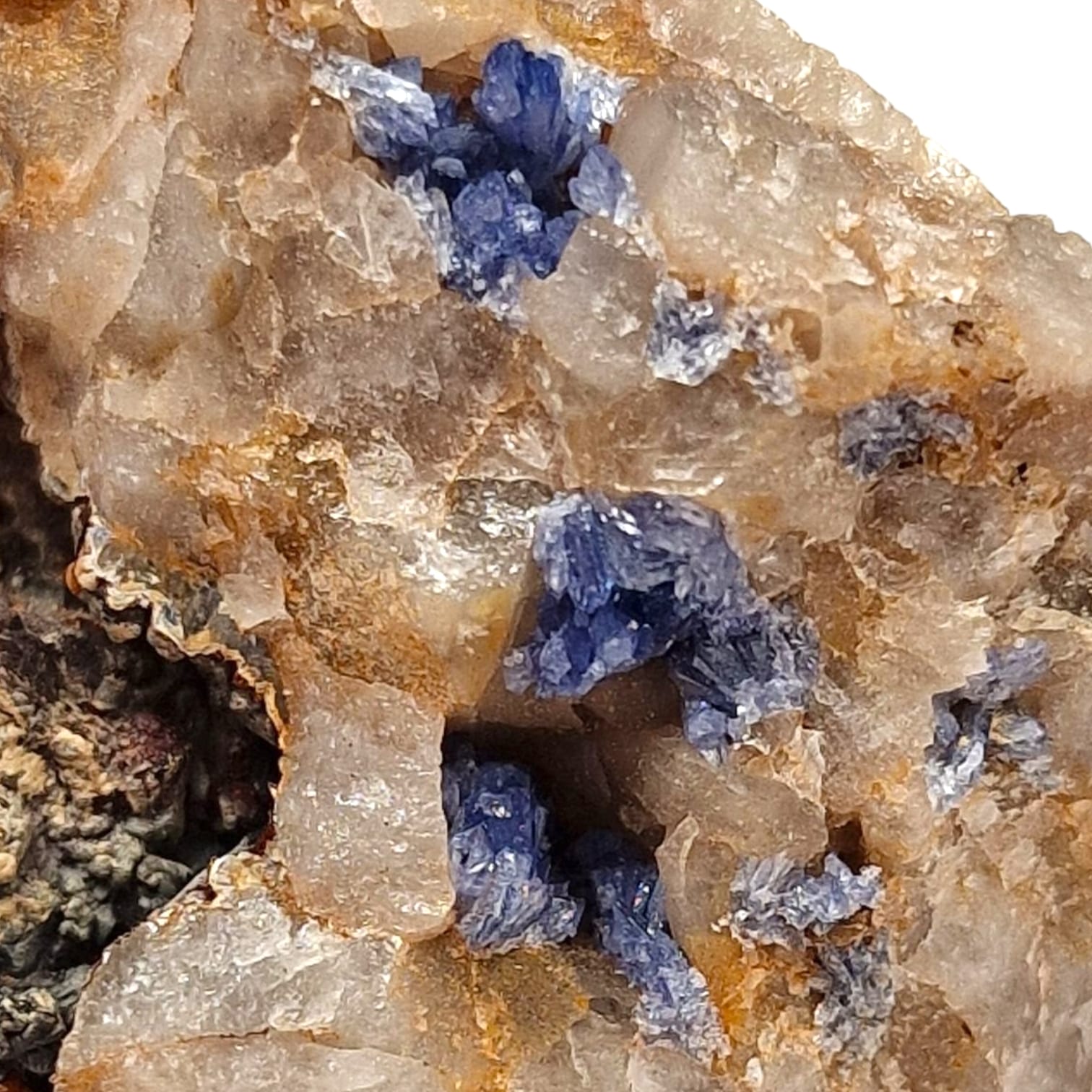 GeoFossils Scorodite Mineral Specimen from Hemerdon Bal, Devon – showing blue-green microcrystals on matrix with iridescent sparkle.