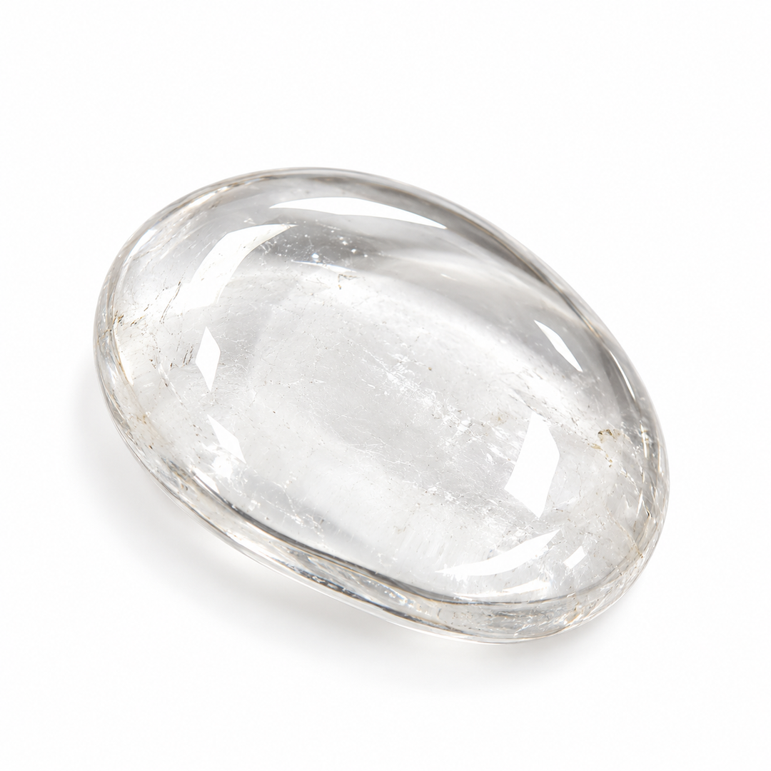 Clear Quartz polished tumble stone with a translucent appearance, natural internal features and smooth glossy surface on a white background.