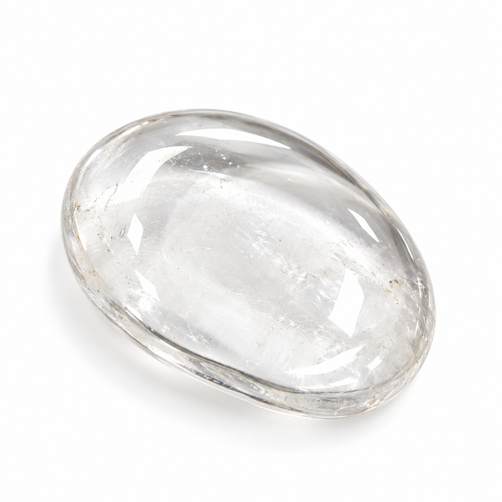 Clear Quartz polished tumble stone with a translucent appearance, natural internal features and smooth glossy surface on a white background.