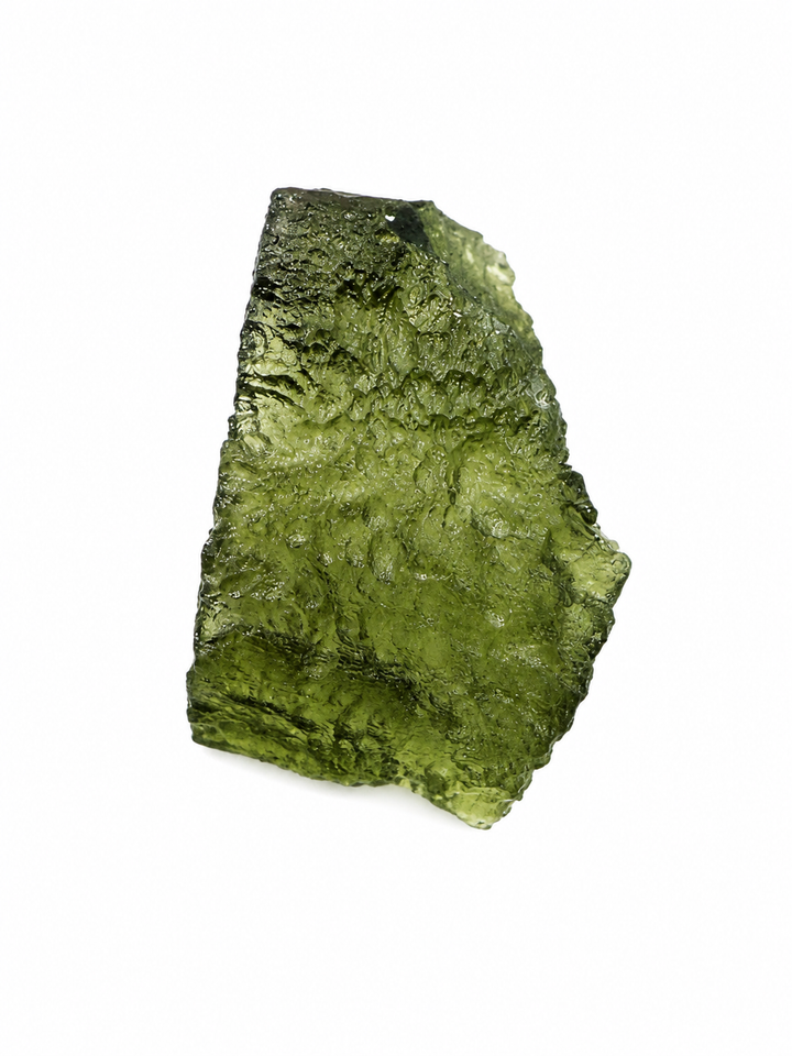 A raw, rough-cut piece of green moldavite crystal with a textured, fibrous structure, isolated on a solid white background.