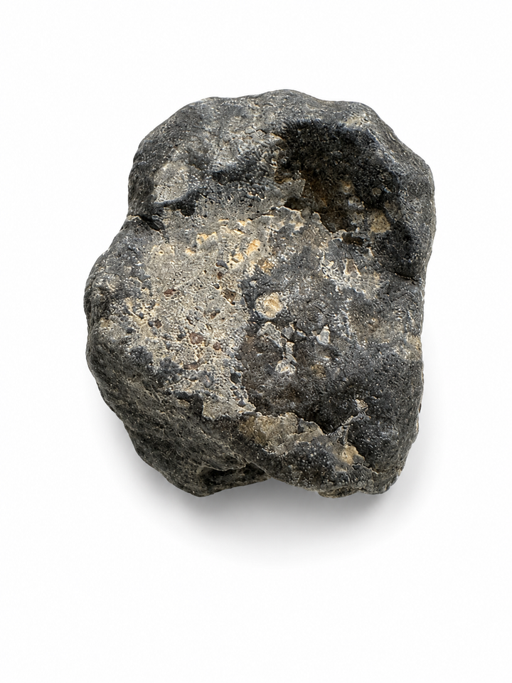 Raw Rumuruti Chondrite displaying natural weathering and surface texture.