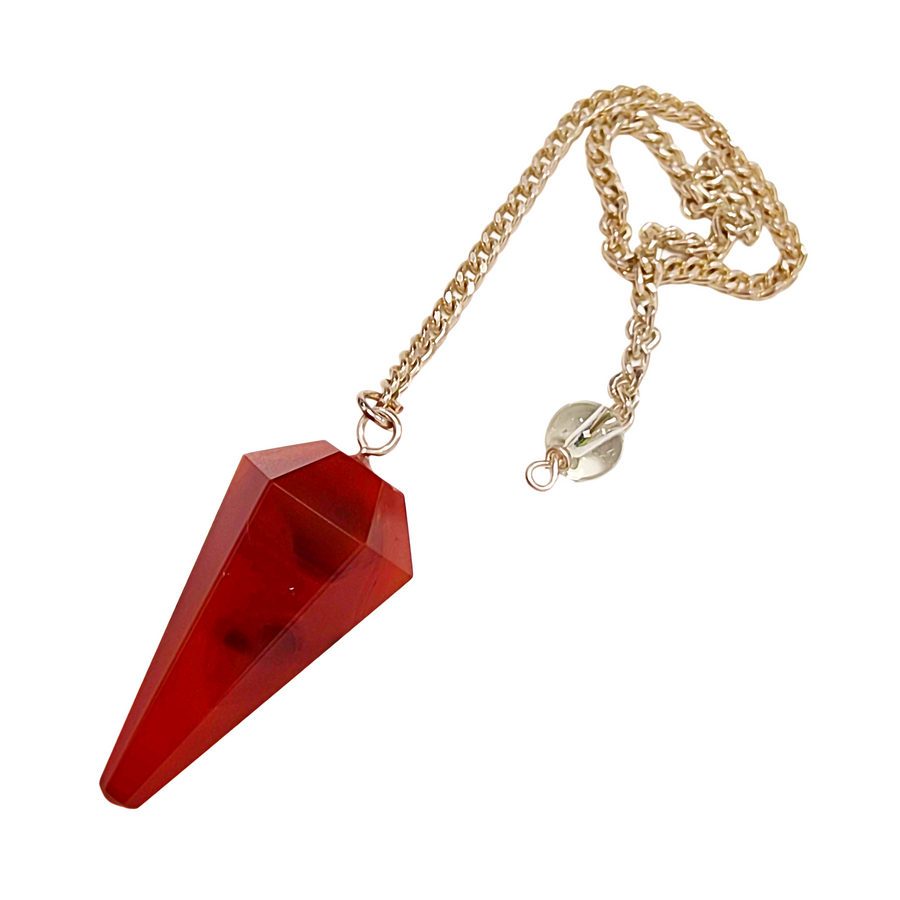 Carnelian pendulum with silver chain on light background
