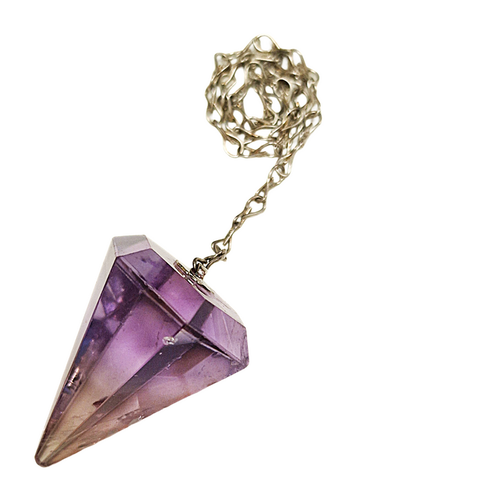Ametrine pendulum with silver-toned chain on white background