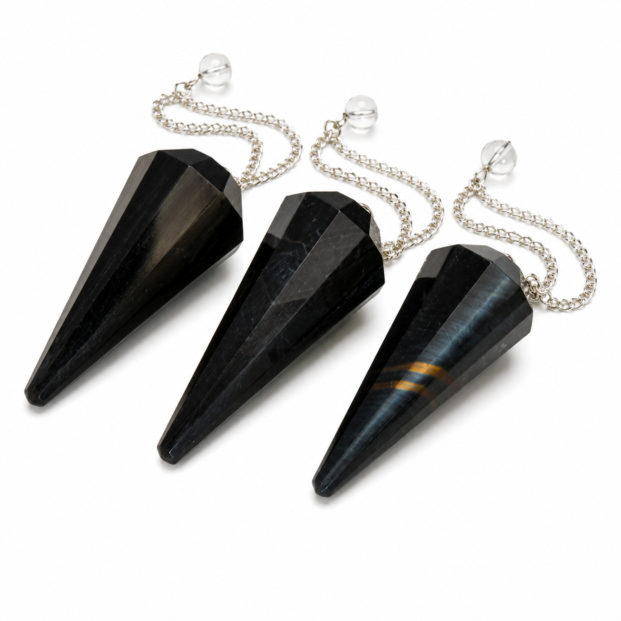 Three faceted black crystal cone pendants with silver chains and clear glass spheres, arranged diagonally on a white background.