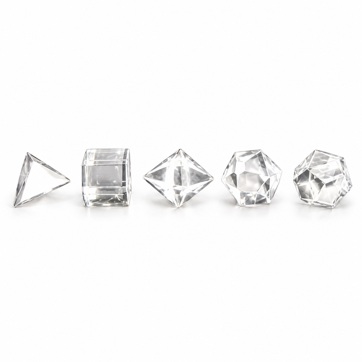 Five polished Clear Quartz Platonic solids arranged in a row on a white background — GeoFossils.