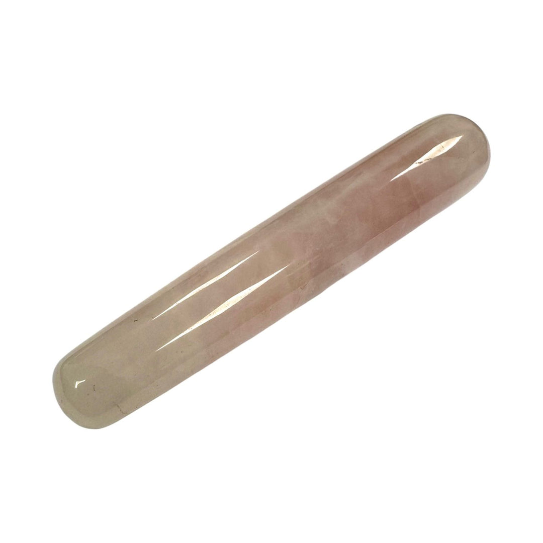 Polished Rose Quartz crystal massage wand with a soft pink hue, smooth cylindrical shape, and rounded ends, crafted for soothing massage, emotional healing, and heart chakra alignment.