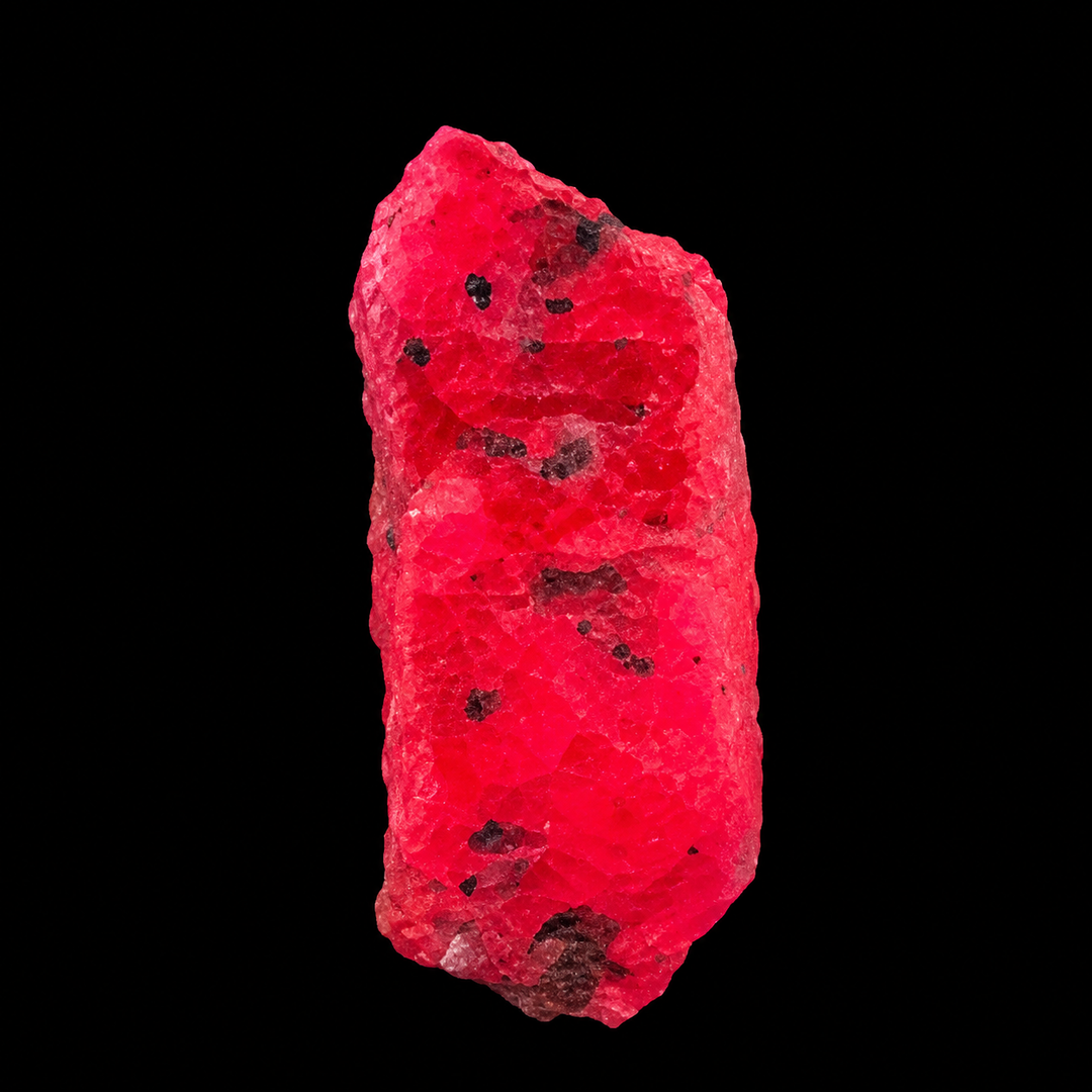 GeoFossils Ruby mineral specimen 212 displaying bright red-pink fluorescence under UV light against a black background.