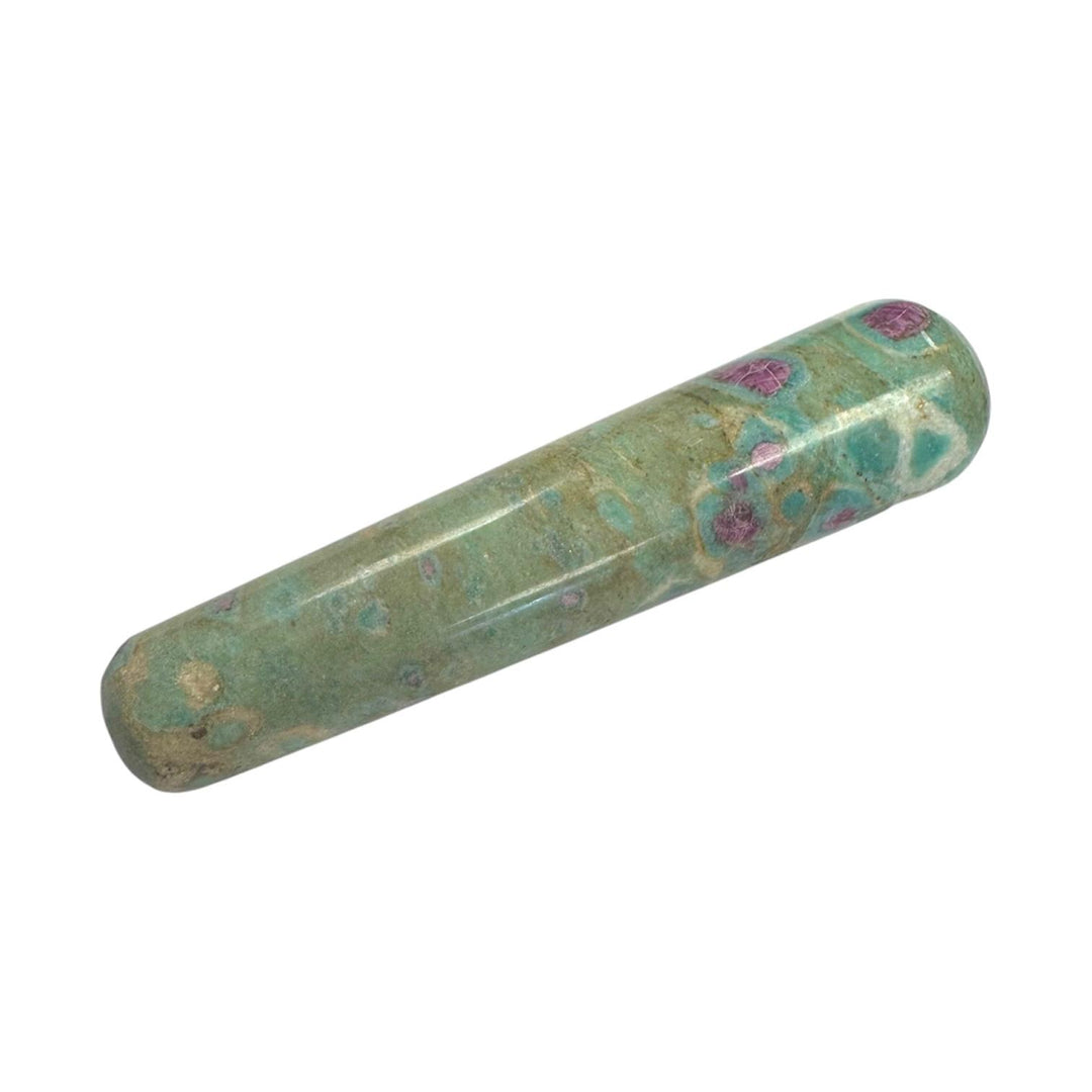 Polished Ruby in Fuchsite crystal massage wand combining vibrant pink ruby inclusions within a green fuchsite matrix, smooth cylindrical shape with rounded ends, used for heart chakra healing, emotional balance, and gentle massage therapy