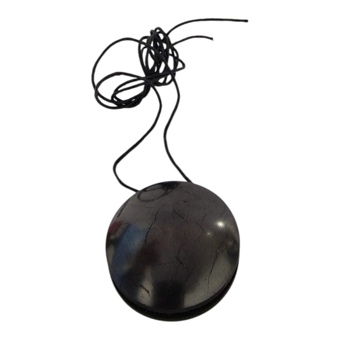 Close-up of Yo-Yo style Shungite pendant showing balanced rounded shape and polished finish