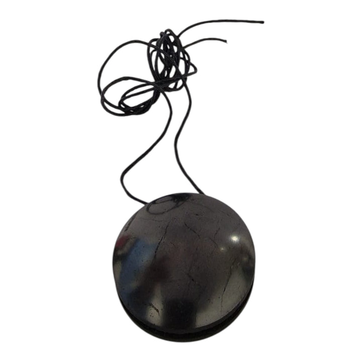 Close-up of Yo-Yo style Shungite pendant showing balanced rounded shape and polished finish