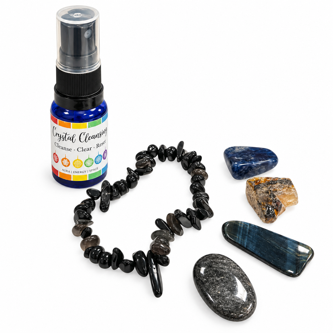 Scorpio Zodiac Crystal Set displayed on a white background with four natural crystals, a Black Obsidian chip bracelet and crystal cleansing spray.