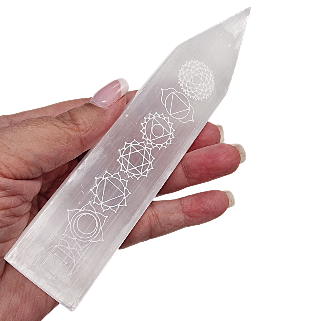 Selenite Chakra Blade – Engraved Polished Wand shown on hand for scale.