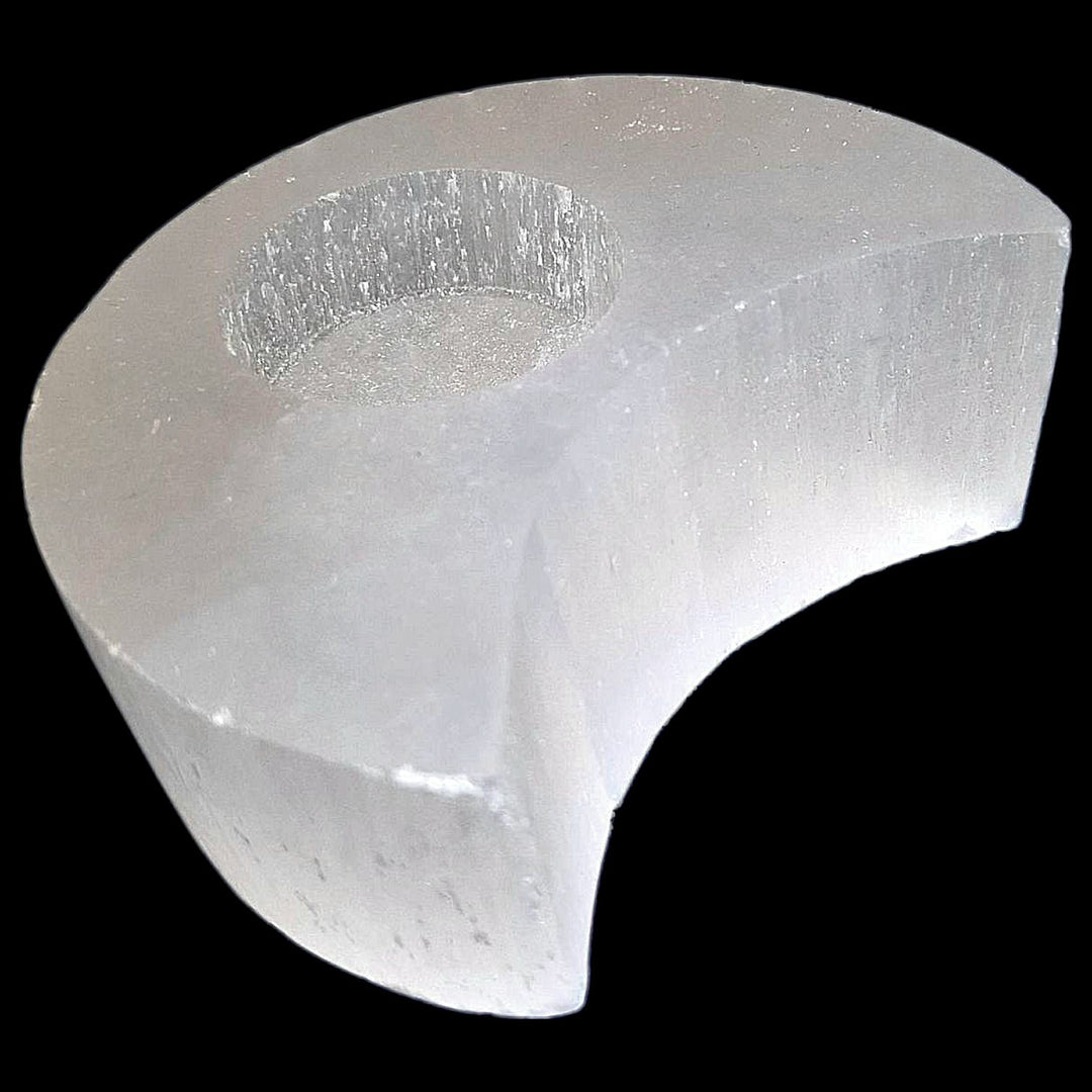 Crescent Moon Selenite Tealight Holder glowing softly, symbolising lunar energy, intuition, and spiritual cleansing.