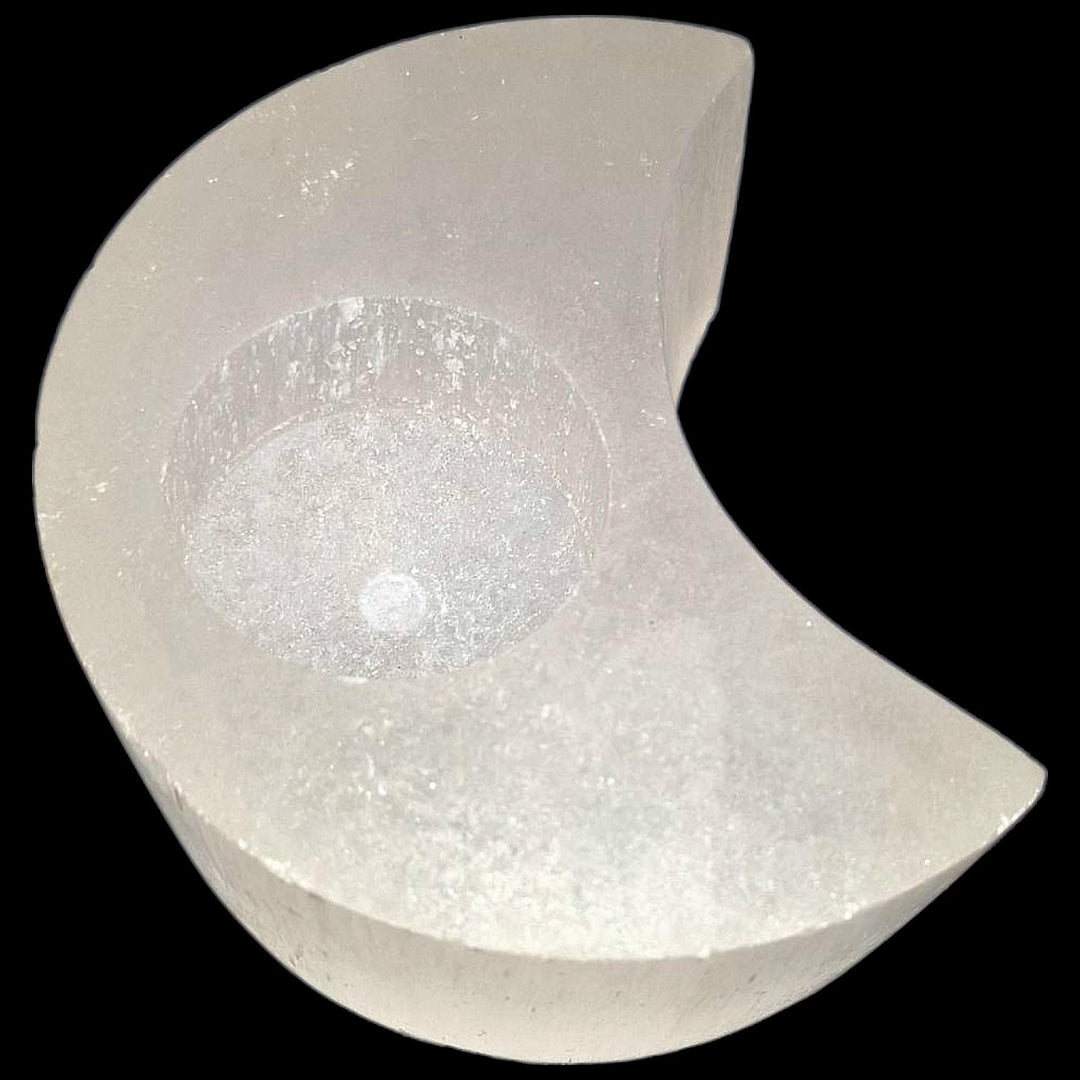 Crescent Moon Selenite Tealight Holder glowing softly, symbolising lunar energy, intuition, and spiritual cleansing.