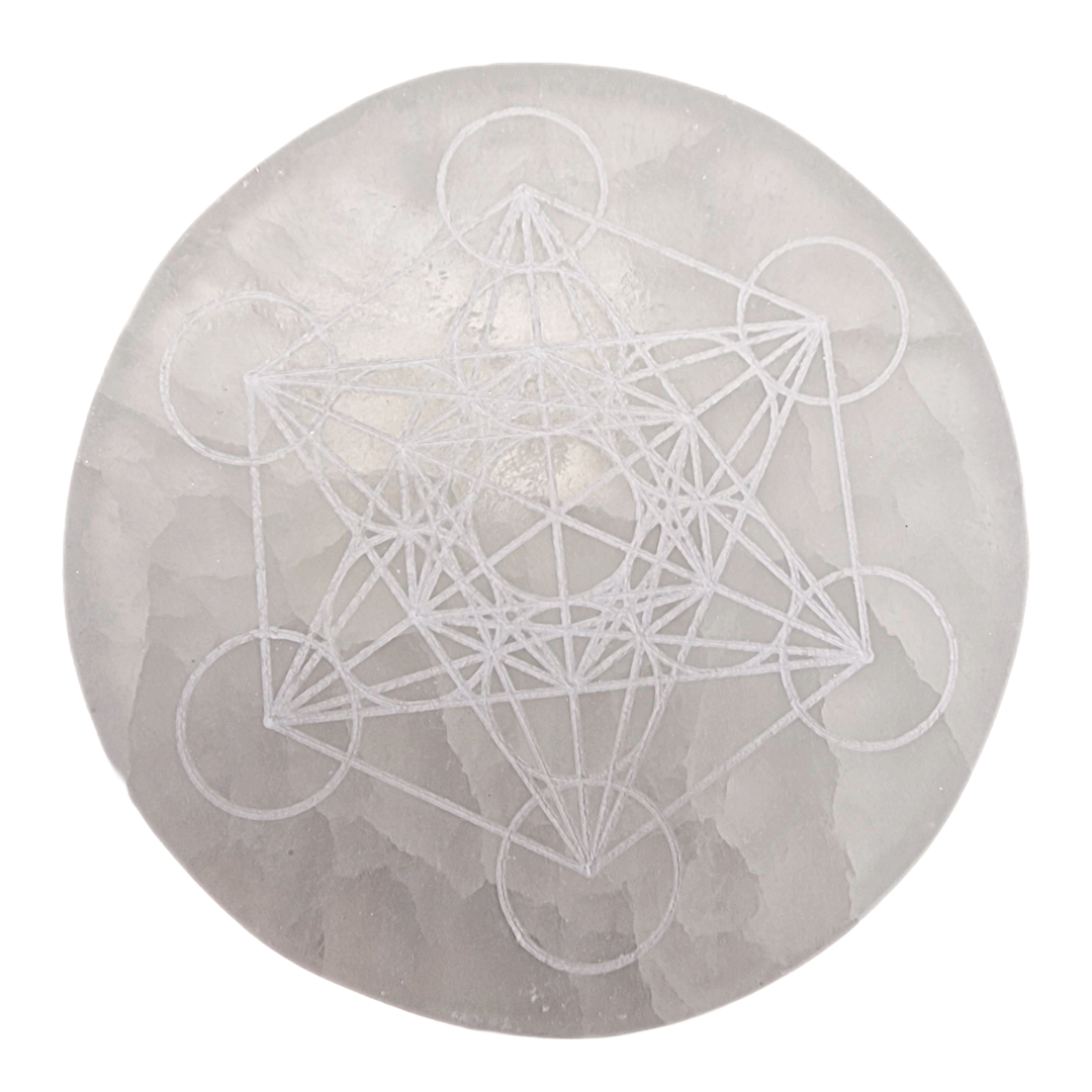 Selenite Charging Disc 10 cm engraved with Metatron’s Cube shown on white background.