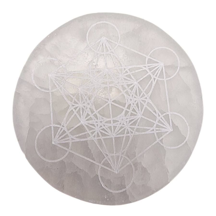Selenite Charging Disc 10 cm engraved with Metatron’s Cube shown on white background.