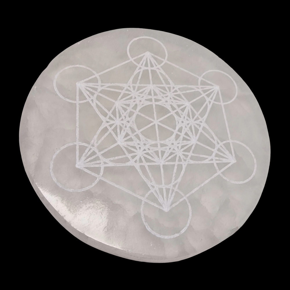 Selenite Charging Disc 10 cm engraved with Metatron’s Cube shown on black background.