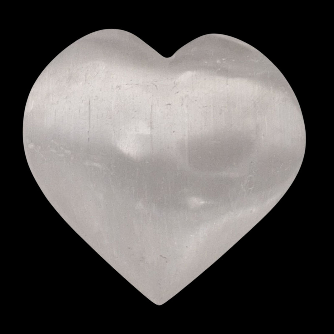 Medium Selenite Heart crystal shown on black background.
