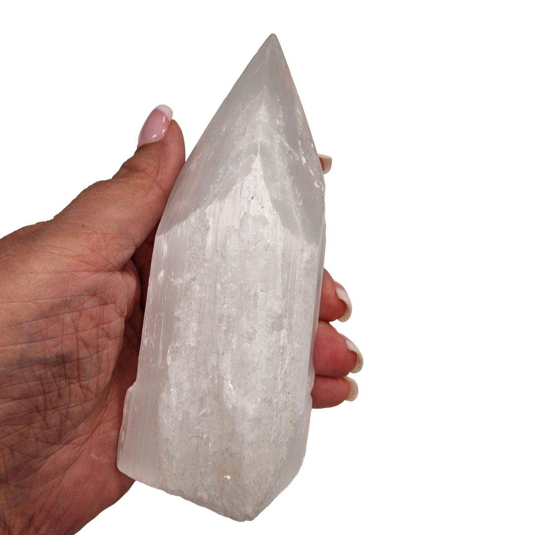 Selenite Tower 12cm polished tip with raw sides shown on hand for scale.