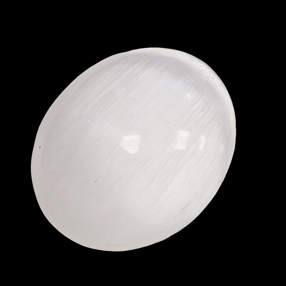 Selenite Palm Stone 90 mm shown on black background.