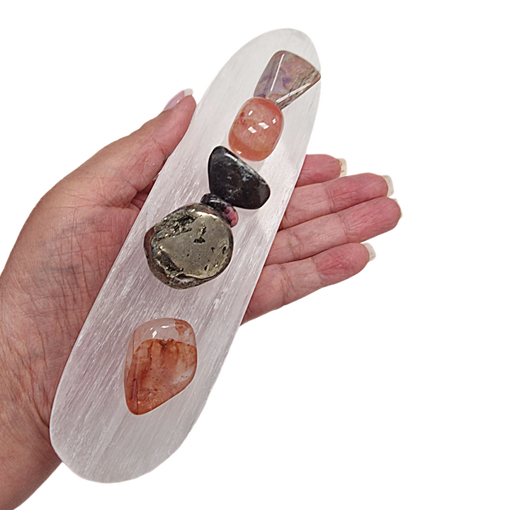 Selenite Charging Tray with Groove shown in hand with scale.