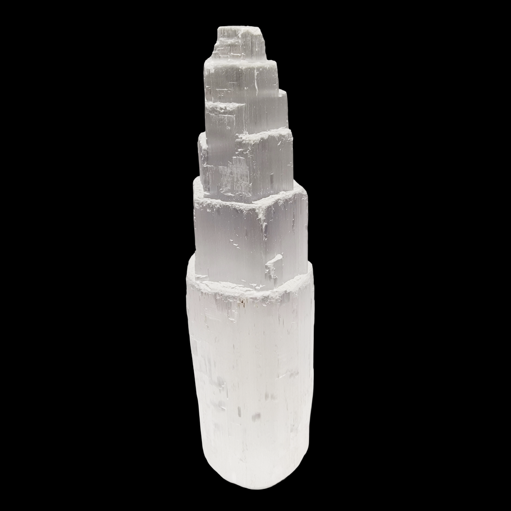 Selenite Tower 15 cm ultra white iceberg finish shown on black background.