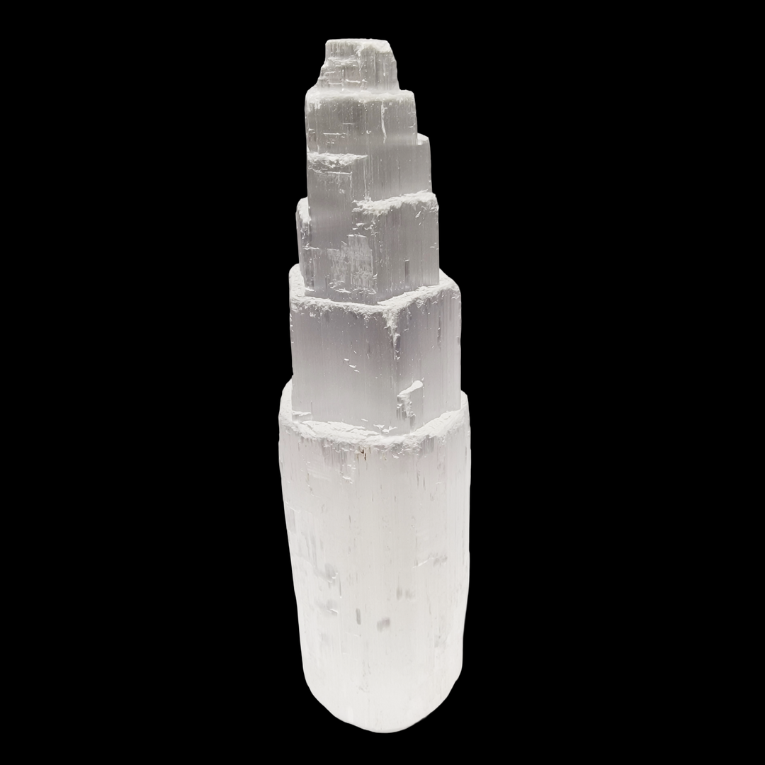 Selenite Tower 15 cm ultra white iceberg finish shown on black background.