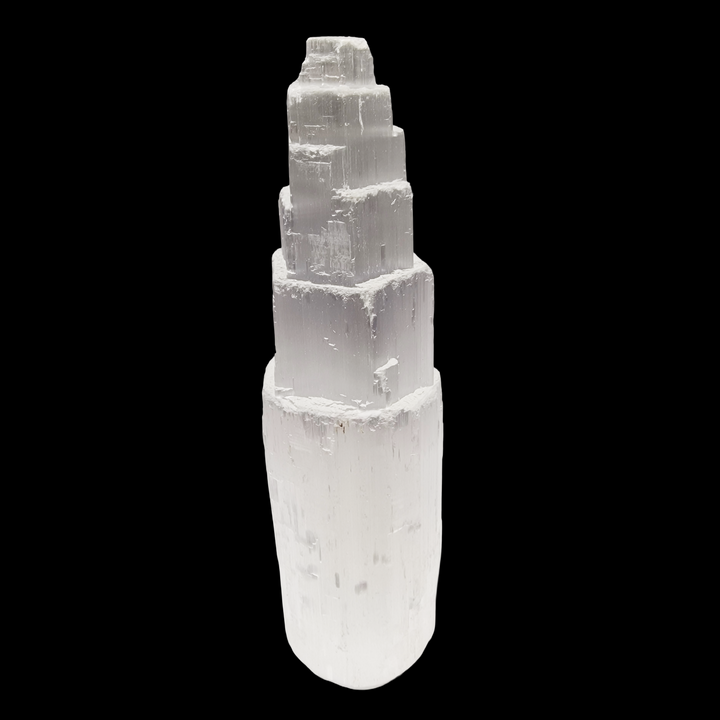 Selenite Tower 15 cm ultra white iceberg finish shown on black background.