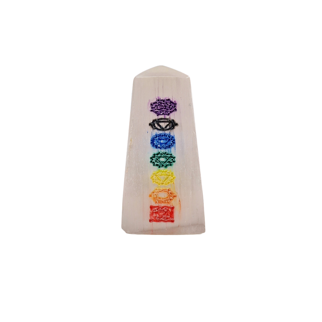 Selenite Chakra Tower 5cm polished mini tower with 7 chakra engravings shown on white background.