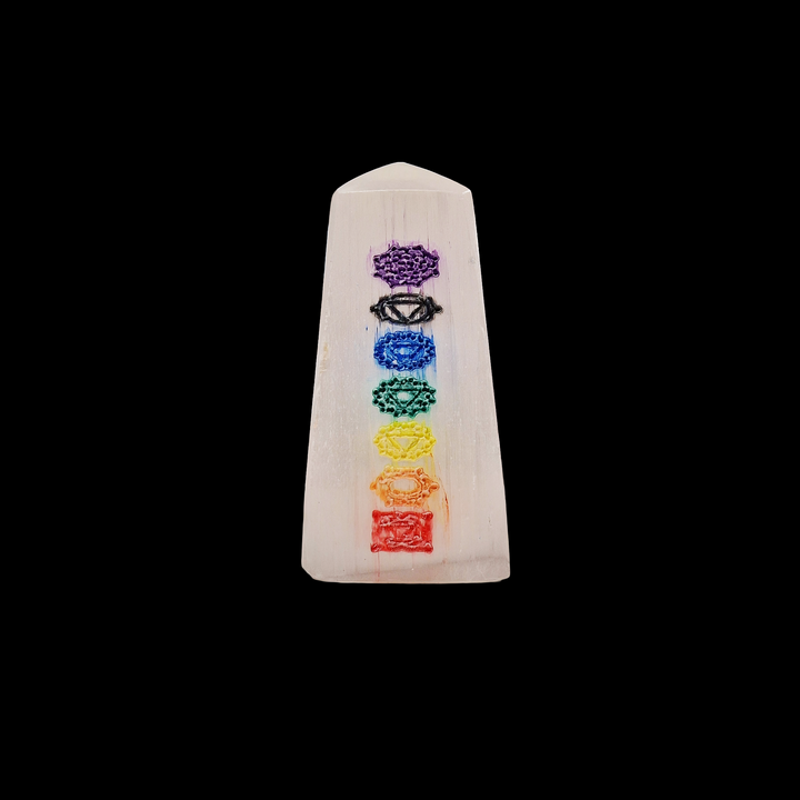 Selenite Chakra Tower 5cm polished mini tower with 7 chakra engravings shown on black background.