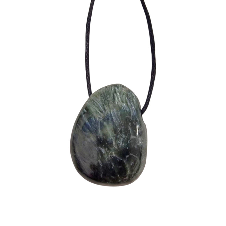 Seraphinite tumble stone pendant with deep forest green tones and feathery silver chatoyancy, displayed on a black cotton cord