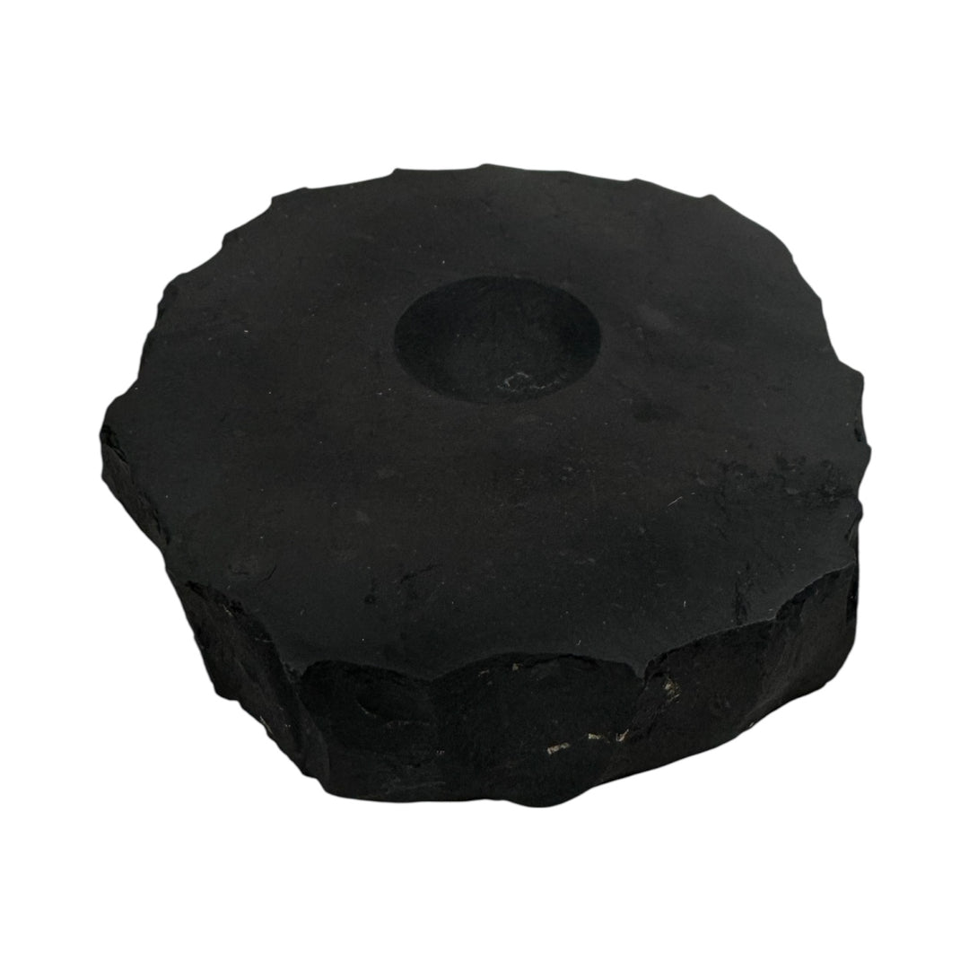 Extra-large shungite base with natural rough edges and carved center, perfect for displaying larger crystal spheres.