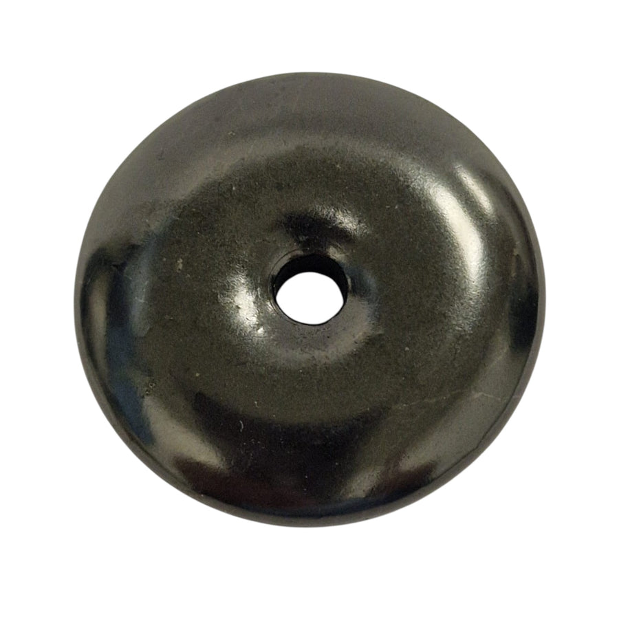 Shungite donut pendant on white background, polished 30mm crystal for grounding and balance