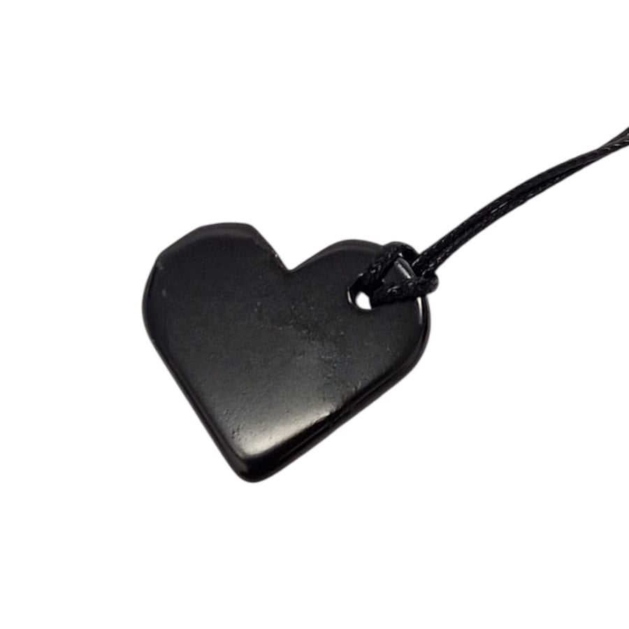 Heart Shungite pendant on white background, polished 30mm crystal for emotional healing and grounding