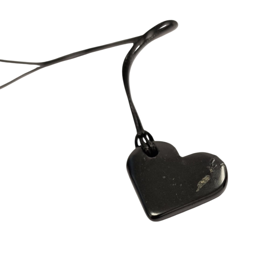 Heart Shungite pendant on white background, polished 30mm crystal for emotional healing and grounding