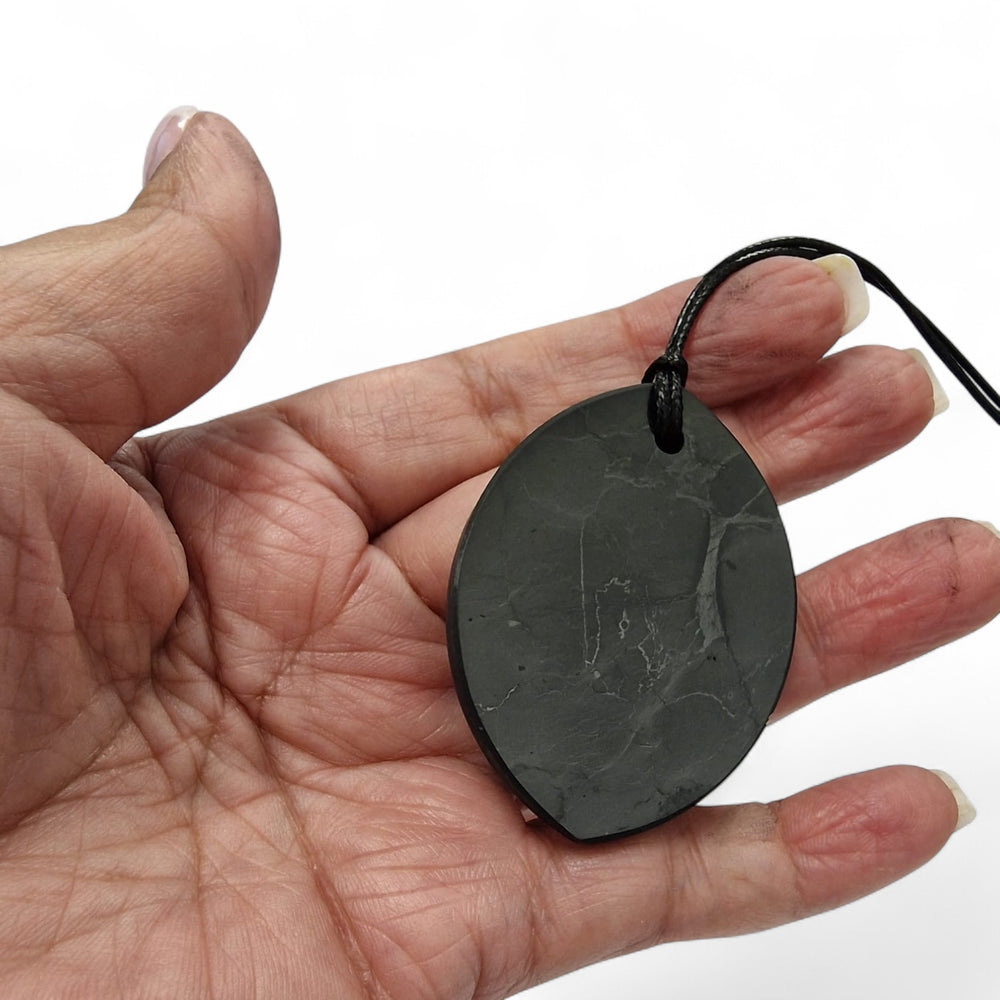 Marquis Shungite pendant on hand, grounding jewellery for EMF protection and spiritual balance