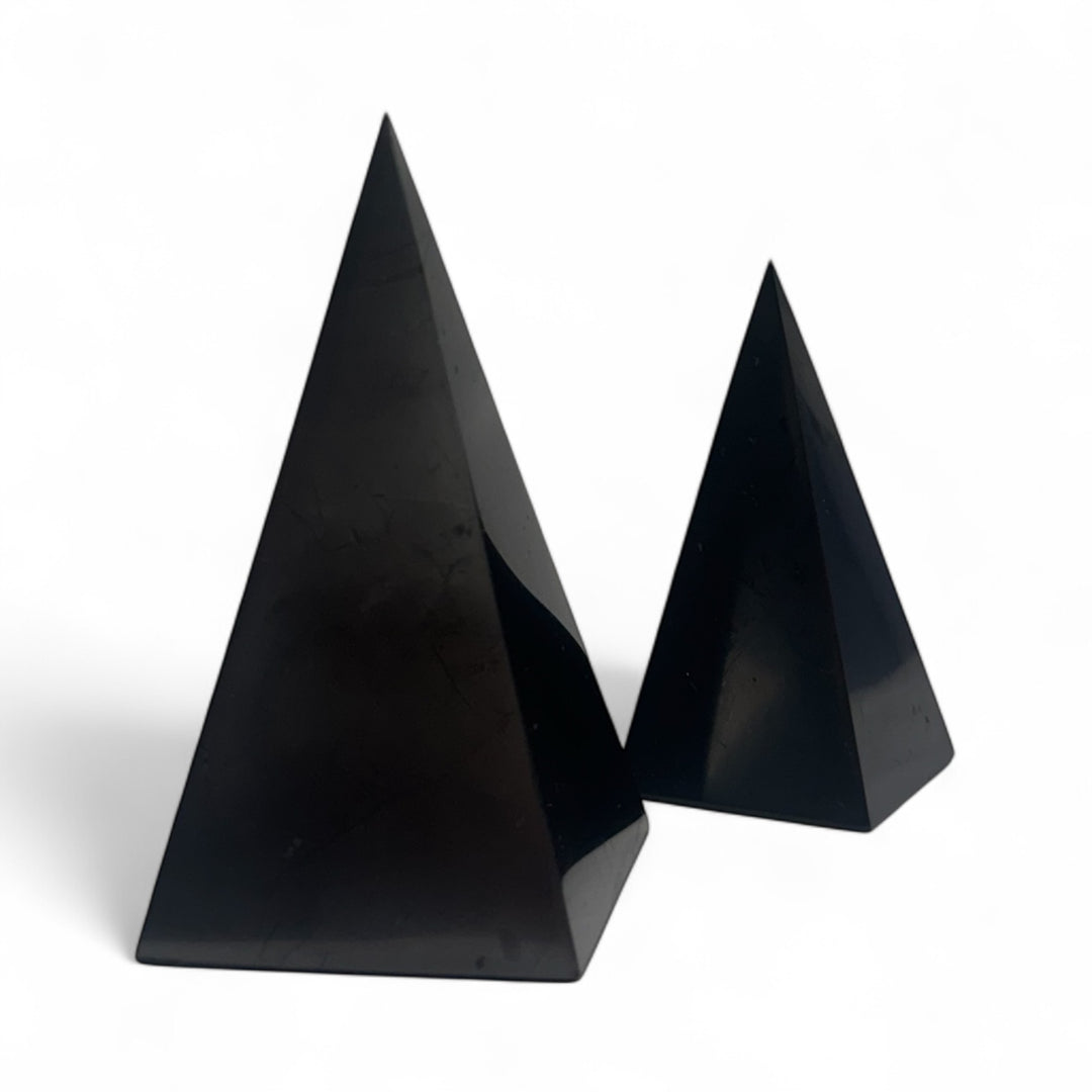 Pair of Shungite Nubian Pyramids in 5cm and 4cm sizes – polished black crystal pyramids for EMF protection, meditation, and energy balancing.