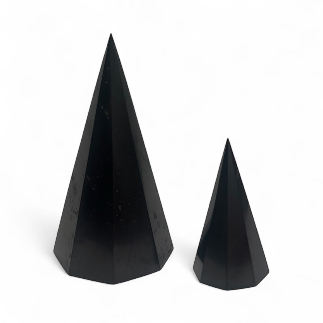 Two Shungite octagonal pyramids (50mm and 12cm), glossy black crystals used for energy balancing, spiritual healing, and home décor