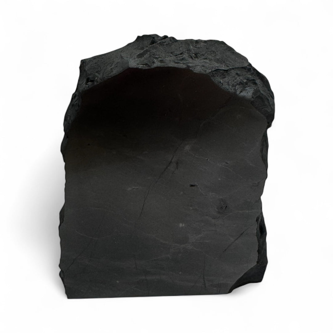 Medium one-face polished shungite stone with natural rough edges, used for EMF protection, grounding, and energy balance.